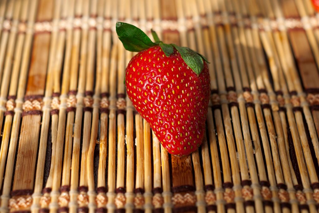 Fresh Red Strawberry on Woven Placemat